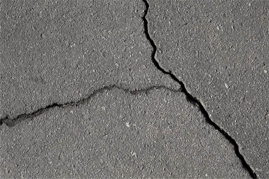 cracked and damaged pavement